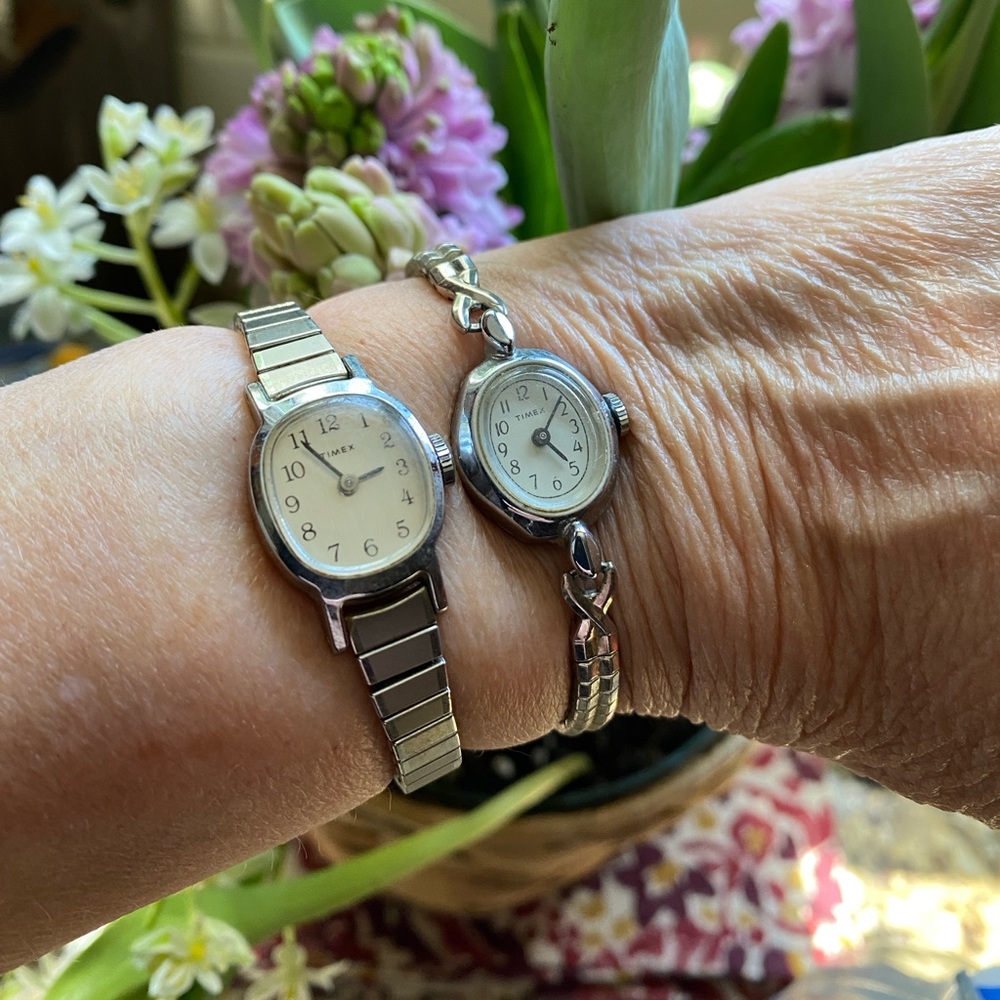 Two vintage Timex watches with stretch bands in silver tone. Need batteries.
